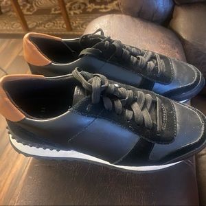 Coach slightly used sneakers. Only wore once and comes from smoke free home.